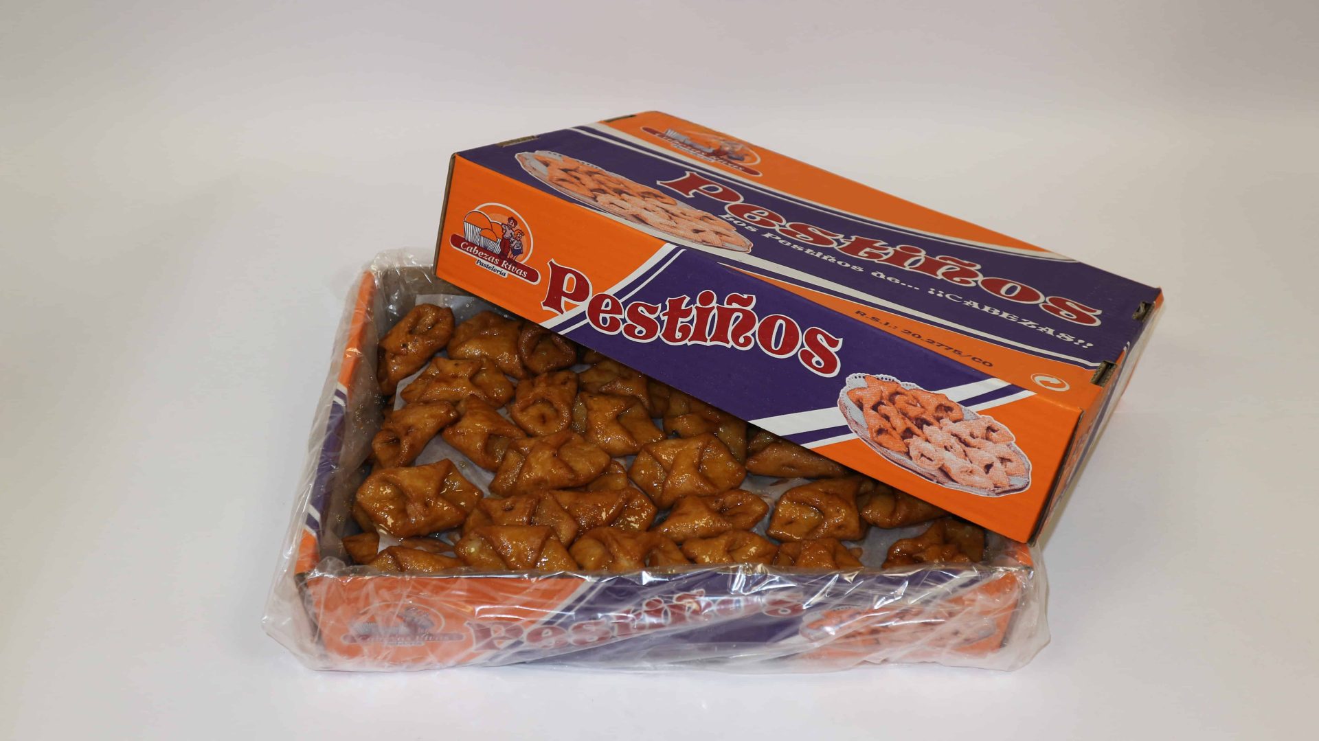 Pestiño de miel tradicional Cabezas, crujiente y bañado en miel dorada
